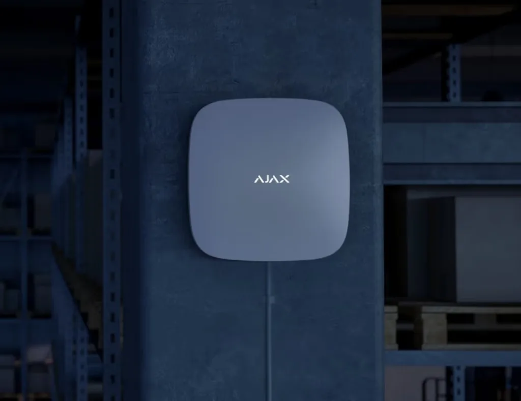 Ajax system hub mounted on a concrete pillar